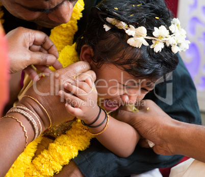 Traditional Indian family ear piercing ceremony