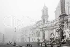 Fountain of the Four Rivers in piazza Navona wrapped in fog