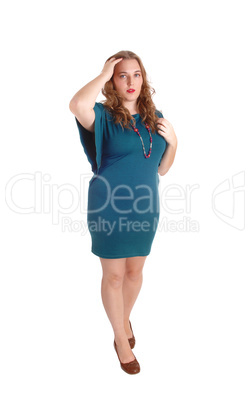 Standing woman in turquoise dress.
