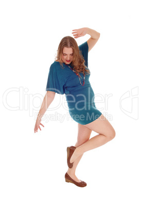 Woman dancing is dress.