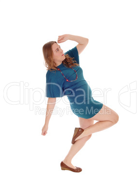 Woman in dress dancing.