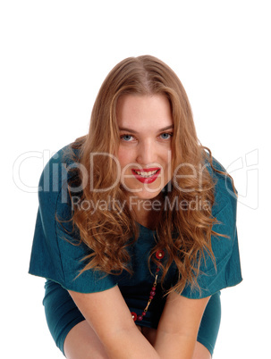 Sitting woman smiling in closeup.