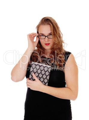 Woman with book and glasses.