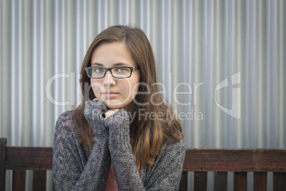 Portrait of Melancholy Young Girl with Glasses