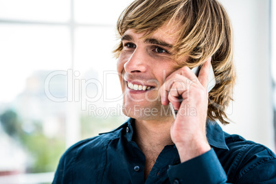 Hipster businessman talking on the phone