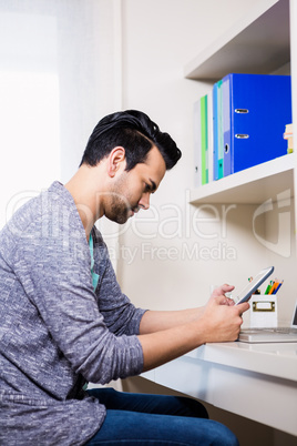 Focused man using tablet