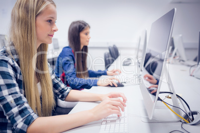 Smiling student working on computer