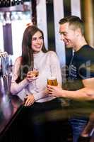 Cute couple talking in a bar