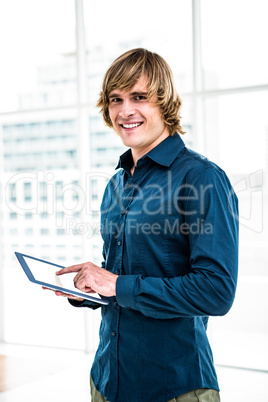 Hipster businessman using tablet