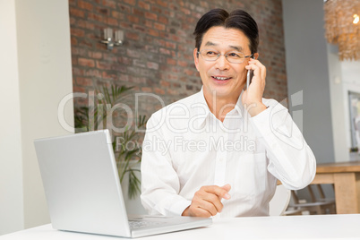 Smiling man on a phone call