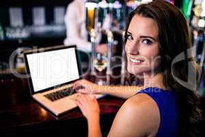 Portrait of woman using laptop