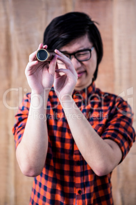 Hipster looking through a telescope