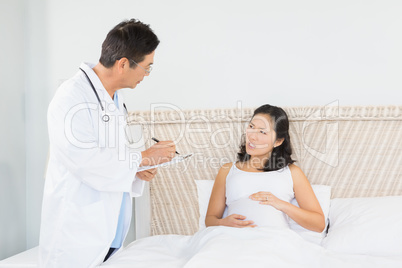 Doctor visiting pregnant woman