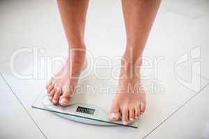Feet of woman on weighting scale