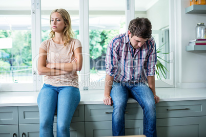 Annoyed couple ignoring each other