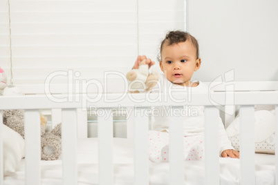 Cute baby playing with plush