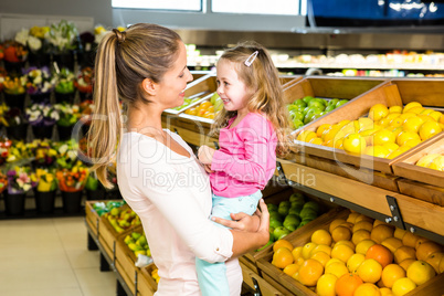 Mother holding her daughter