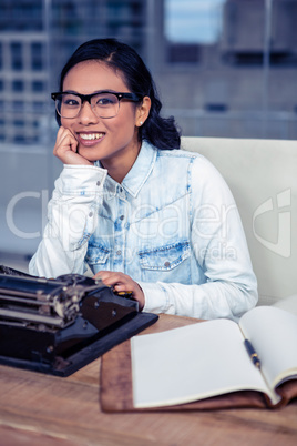 Asian woman typewriting