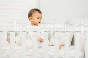 Cute baby on crib