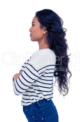 Side view of Asian woman with arms crossed