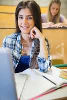 Smiling students working in class