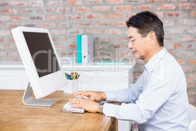 Serious man using computer