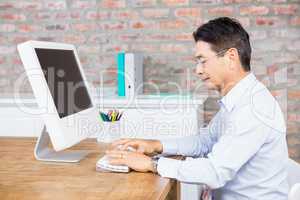 Serious man using computer