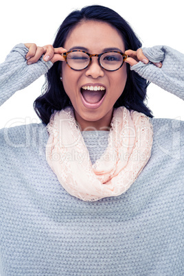 Asian woman holding eyeglasses