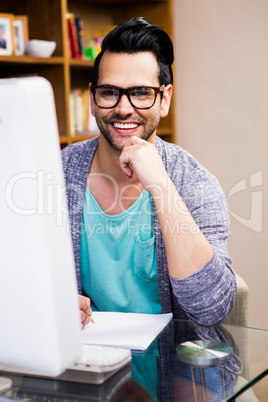 Smiling designer working at the desk