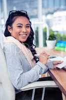 Asian businesswoman holding paper sheet