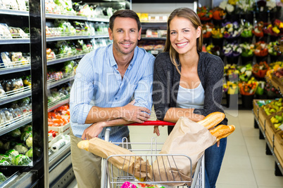 Cute couple doing grocery shopping together