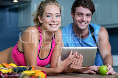 Healthy couple looking at tablet