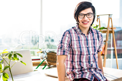 Smiling hipster businessman posing for camera