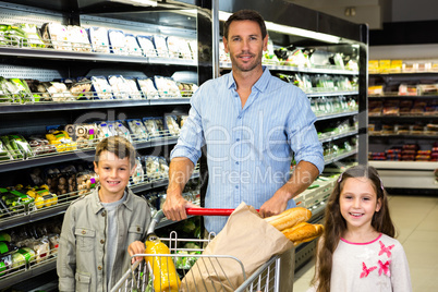 Smiling family doing shopping