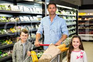 Smiling family doing shopping