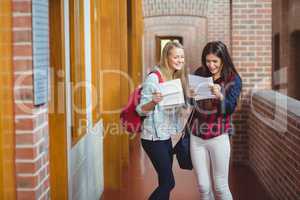 Smiling students looking at results