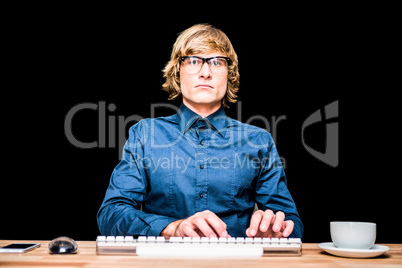 Focused hipster businessman using computer