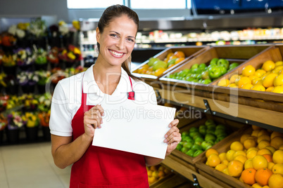 Female worker holding blank sign
