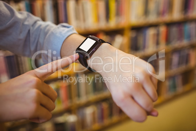 Brunette student using her smart watch