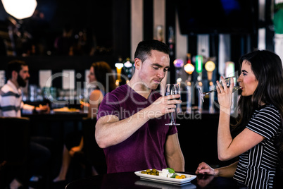 Couple having an aperitif with wine