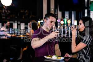 Couple having an aperitif with wine