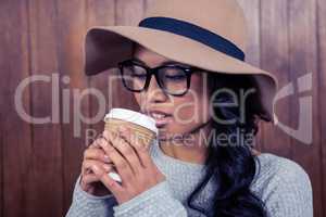 Asian woman drinking by disposable cup