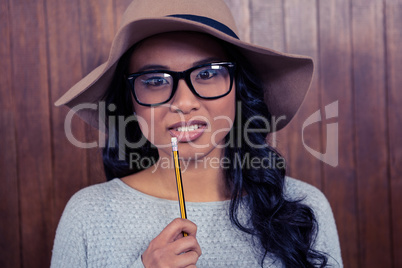Asian woman holding pencil