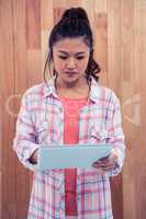 Asian woman using tablet