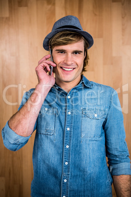 Smiling blonde hipster phone calling