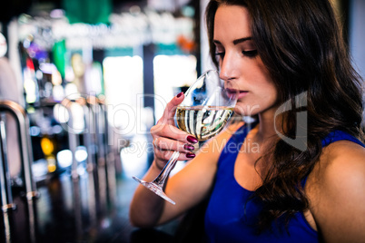 Attractive woman drinking wine