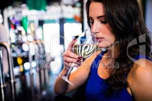Attractive woman drinking wine