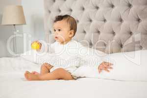 Cute baby playing with ball