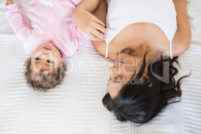 Brunette playing with her baby