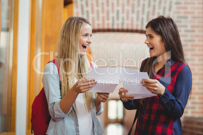 Smiling students looking at results